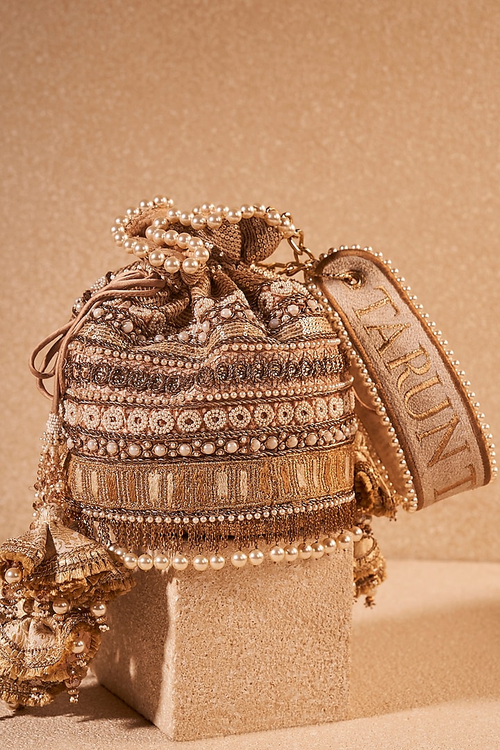 Ivory Gold Poly Dupion & Viscose Satin Hand Embroidered Potli Bag by Tarun Tahiliani Accessories at Pernia's Pop Up Shop