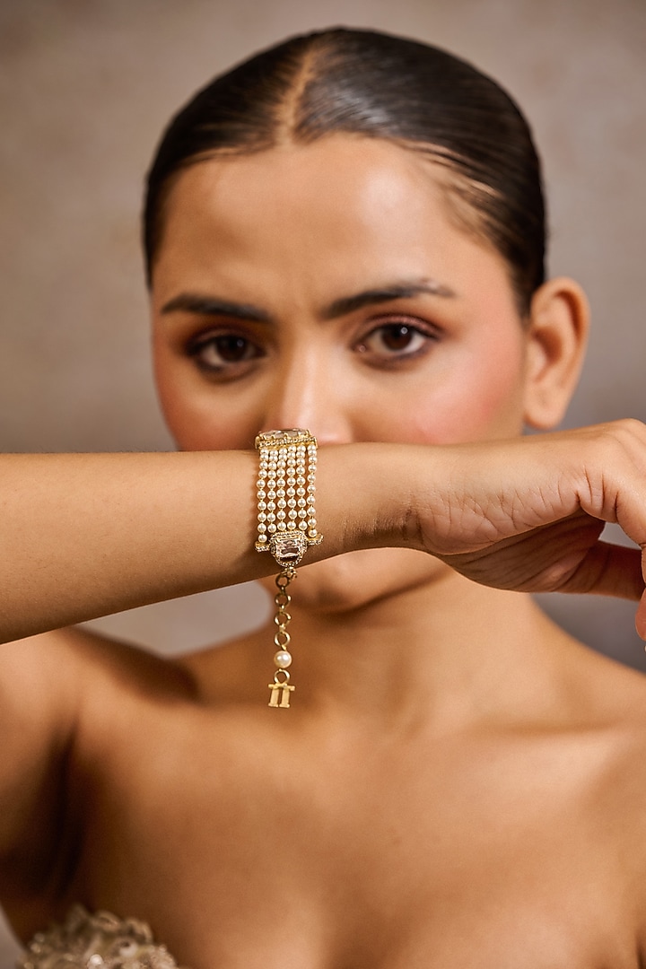 Gold Plated Zircon & Ivory Swarovski Pearl Bracelet In Sterling Silver by Tarun Tahiliani Jewellery at Pernia's Pop Up Shop