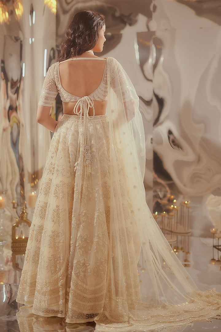 Off-White Tulle & Silk Organza Zari Embroidered Bridal Lehenga Set by TUHINA SRIVASTAVA at Pernia's Pop Up Shop