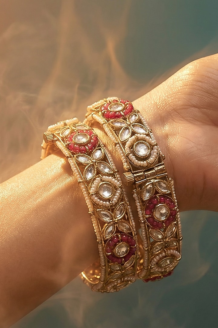 Micro Gold Finish Kundan Polki & Pearl Bangles (Set Of 2) by Tussya at Pernia's Pop Up Shop