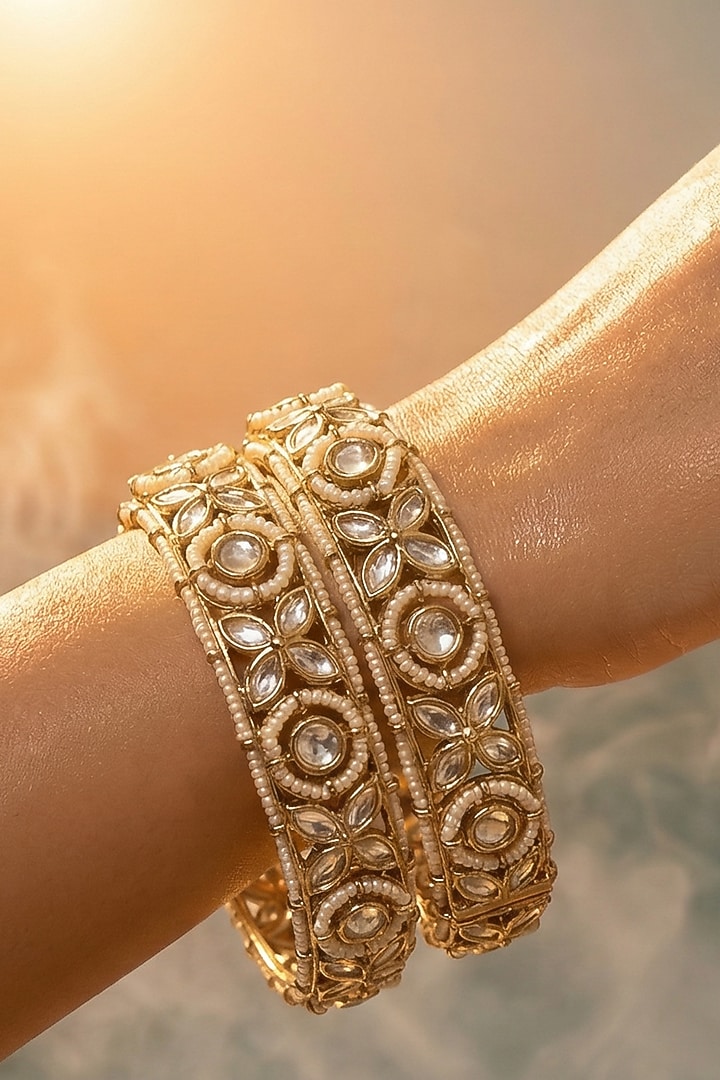 Micro Gold Finish Kundan Polki & Pearl Bangles (Set Of 2) by Tussya at Pernia's Pop Up Shop