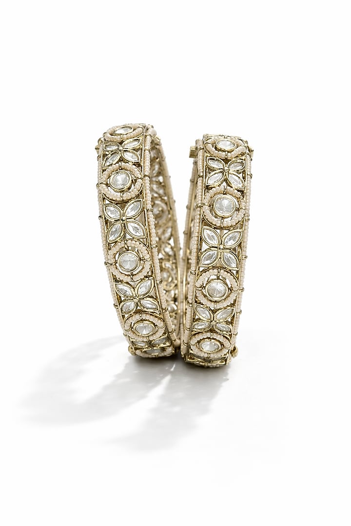 Micro Gold Finish Kundan Polki & Pearl Bangles (Set Of 2) by Tussya at Pernia's Pop Up Shop