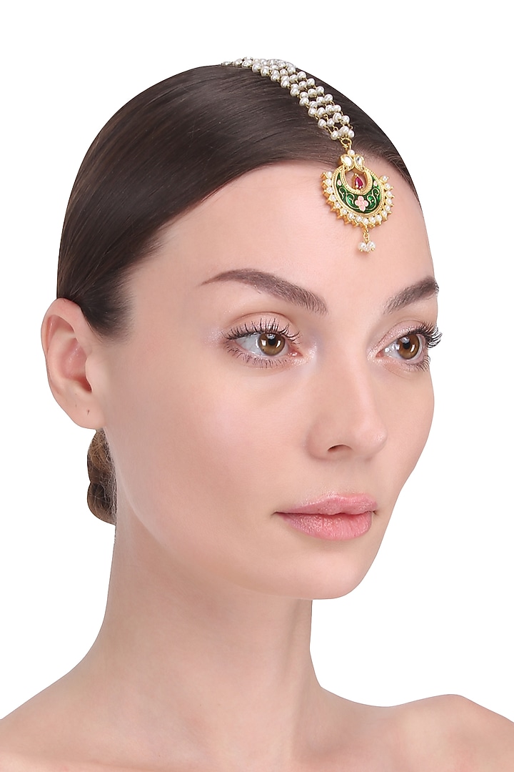 Tanvi Garg presents Gold finish green crescent motid maang tikka avialable only at Pernia's Pop Up Shop.