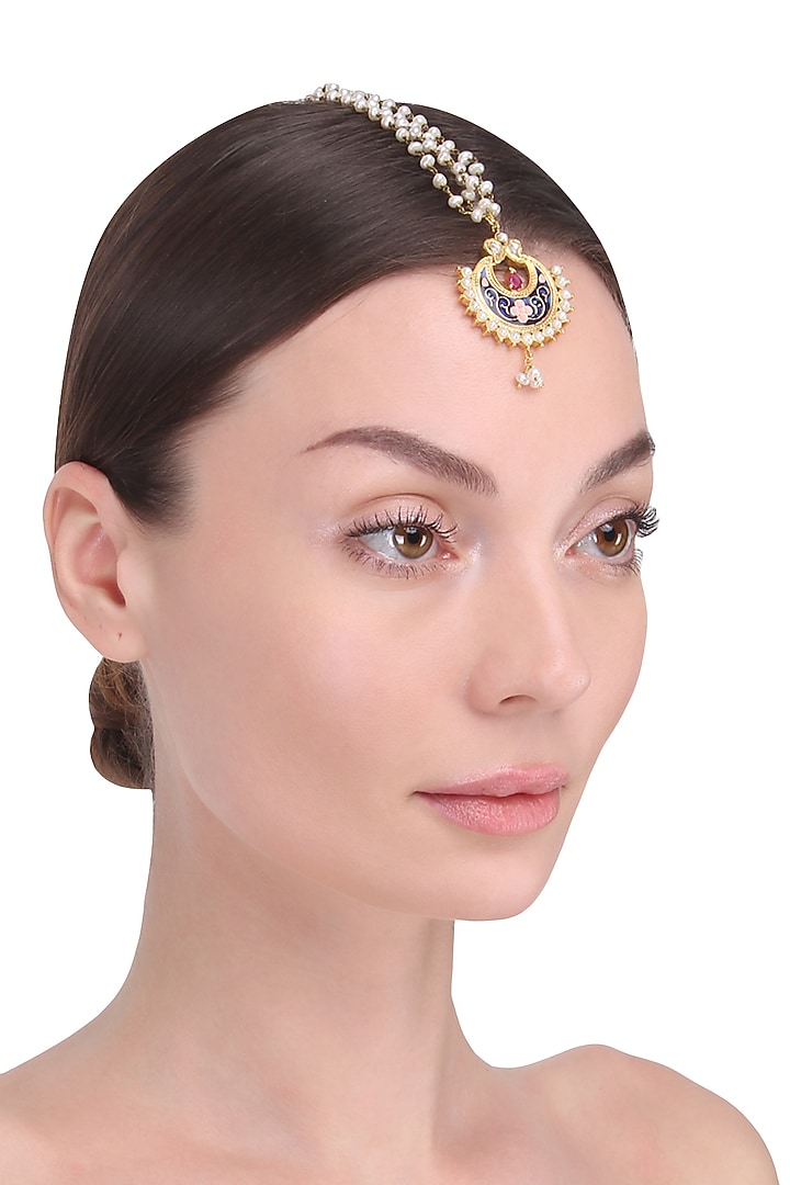 Tanvi Garg presents Gold finish blue crescent motid maang tikka available only at Pernia's Pop Up Shop.