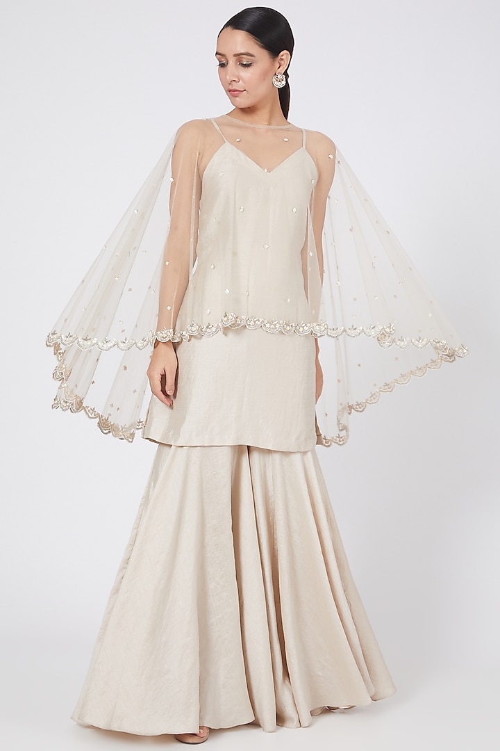 Ivory Sharara Set With Embroidered Cape by Twinkle Hanspal