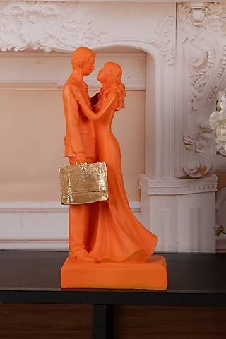 Orange Polyresin Antique Couple Showpiece by The White Ink Decor