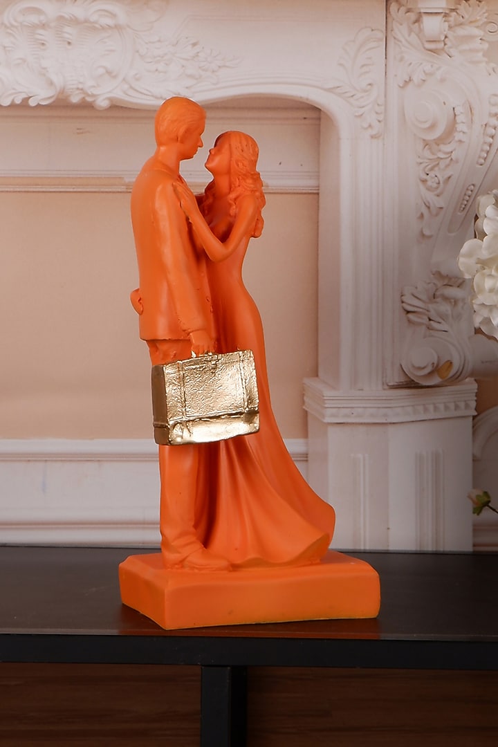 Orange Polyresin Antique Couple Showpiece by The White Ink Decor at Pernia's Pop Up Shop