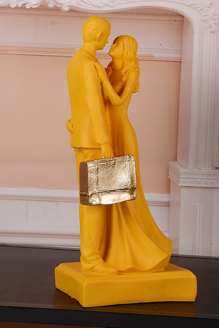 Yellow Polyresin Antique Couple Showpiece by The White Ink Decor at Pernia's Pop Up Shop