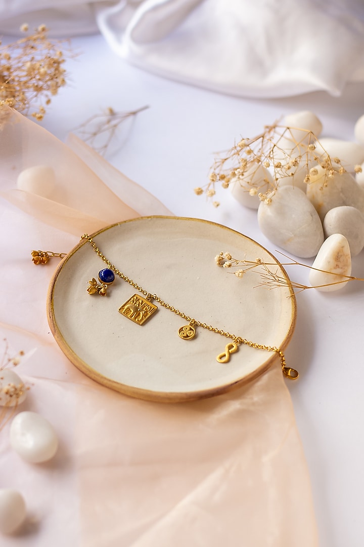 Gold Finish Indus Valley Charm Bracelet In Sterling Silver by URBANZAVERI at Pernia's Pop Up Shop