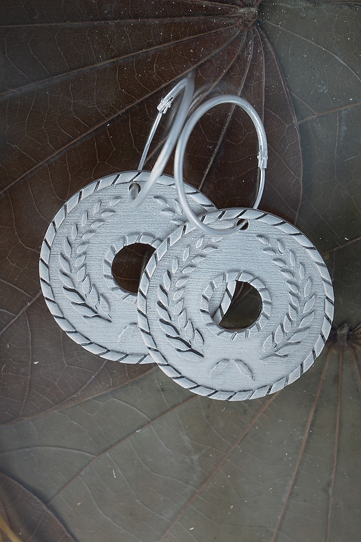 White Finish Wreath Hoop Earrings In Sterling Silver by URBANZAVERI