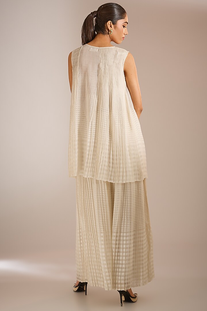 Ecru Handloom Chanderi Silk Pleated Pants by Urvashi Kaur at Pernia's Pop Up Shop