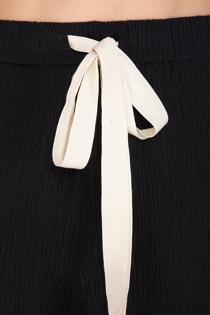 Black Textured Slouchy Pants by Urvashi Kaur at Pernia's Pop Up Shop