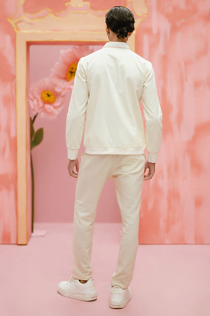 Ivory Handwoven Cotton Pintuck Handcrafted Bomber Jacket by VAANI BESWAL MEN at Pernia's Pop Up Shop