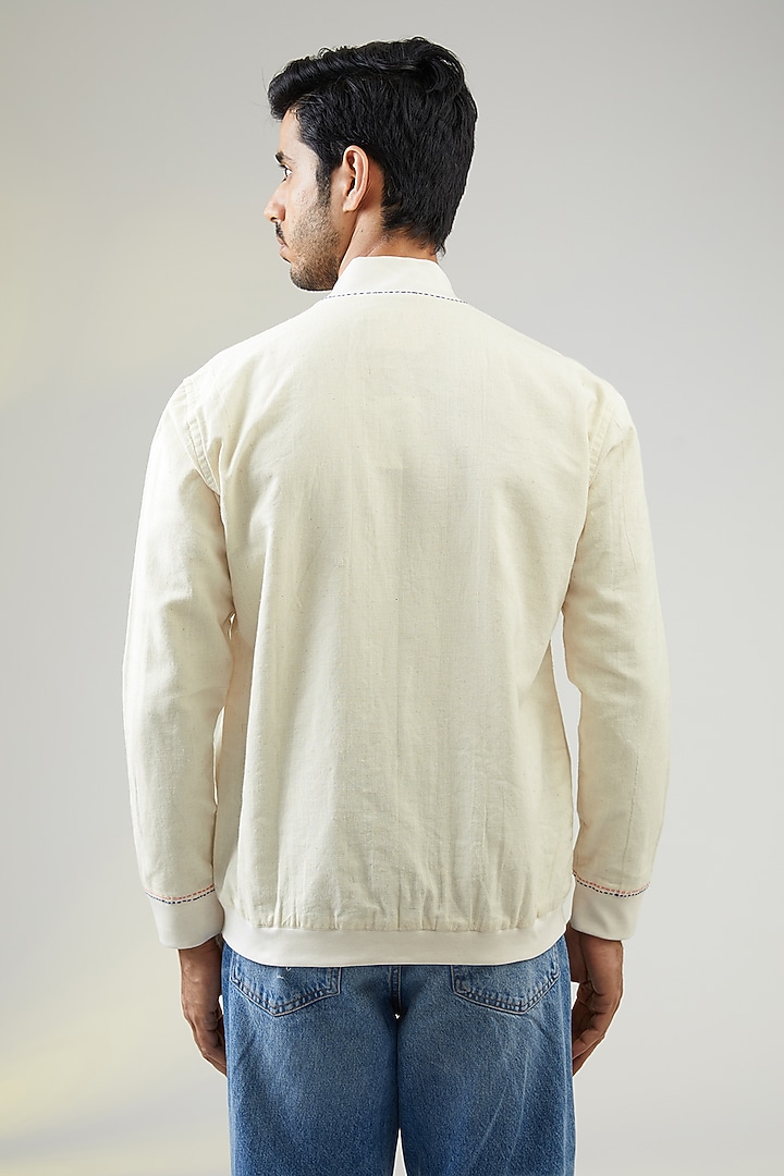 Ivory Handwoven Cotton Linen Printed & Embroidered Bomber Jacket by VAANI BESWAL MEN at Pernia's Pop Up Shop