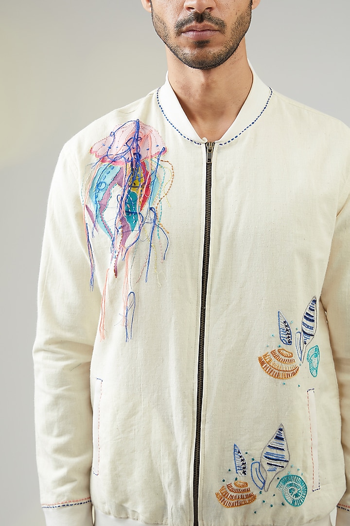Ivory Handwoven Cotton Linen Printed & Embroidered Bomber Jacket by VAANI BESWAL MEN at Pernia's Pop Up Shop