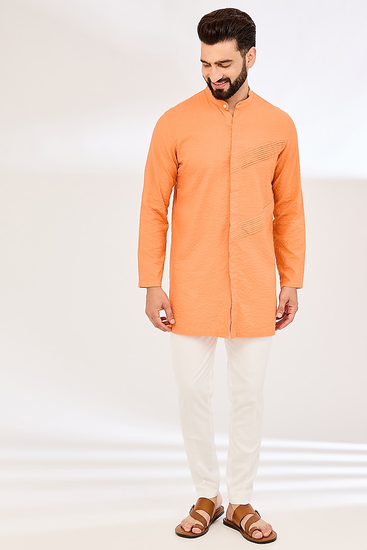 Orange Seersucker Pleated Kurta by VAANI BESWAL MEN