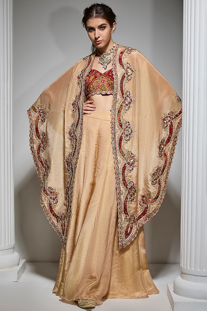 Gold Tissue Hand Embroidered Jacket Lehenga Set by Vannikaa Malik