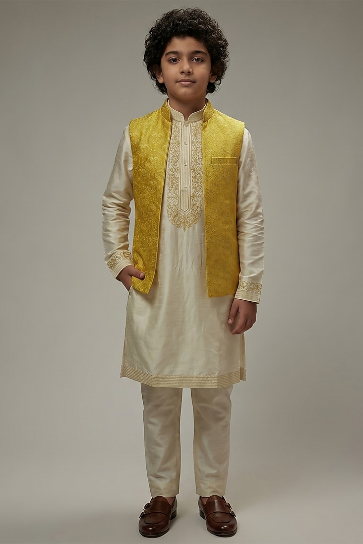 Yellow Dupion Silk Embroidered Bundi Jacket Set For Boys by Vanshik Kids at Pernia's Pop Up Shop