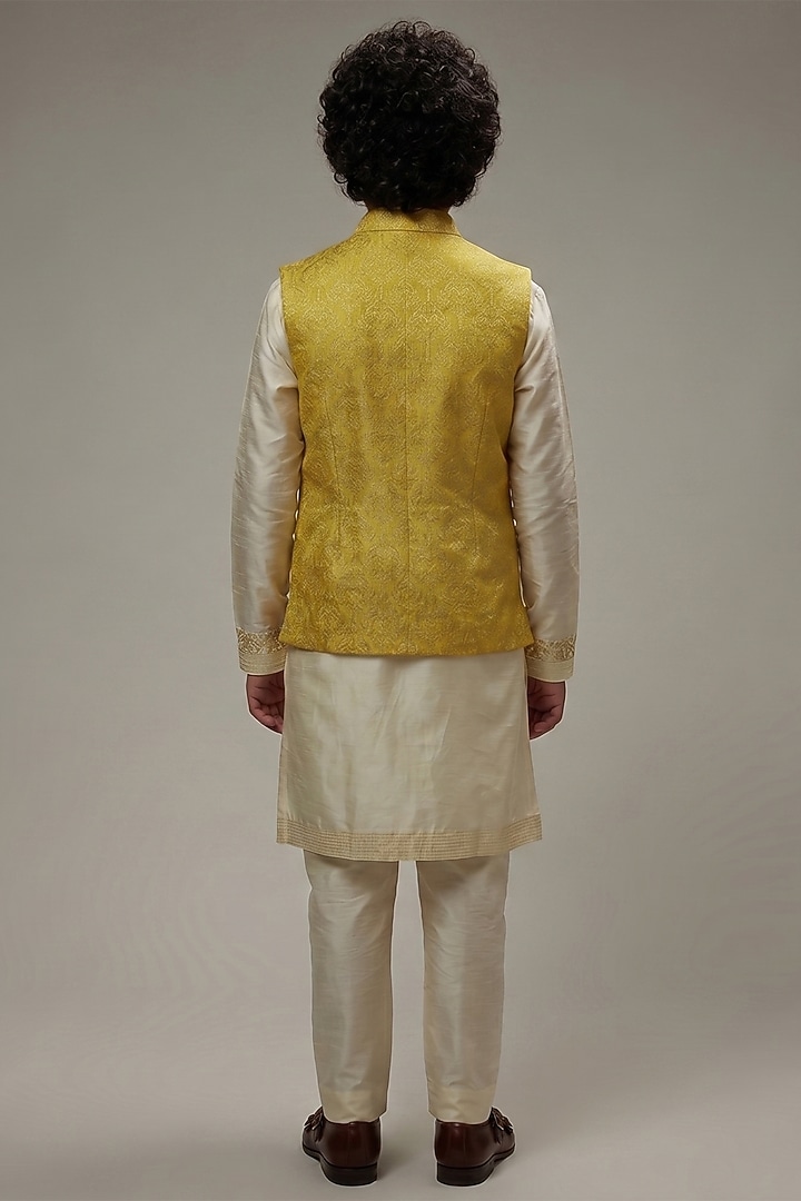 Yellow Dupion Silk Embroidered Bundi Jacket Set For Boys by Vanshik Kids at Pernia's Pop Up Shop