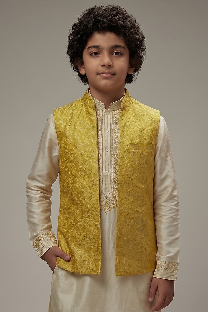 Yellow Dupion Silk Embroidered Bundi Jacket Set For Boys by Vanshik Kids at Pernia's Pop Up Shop