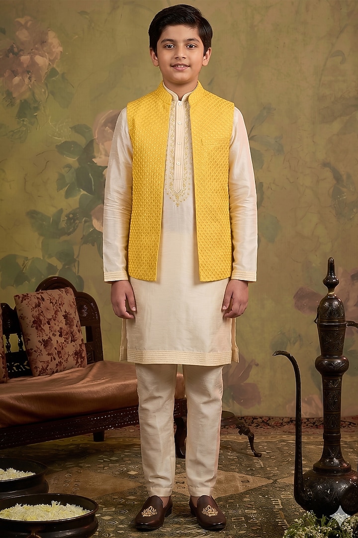 Yellow Silk Embroidered Bundi Jacket Set For Boys by Vanshik Kids at Pernia's Pop Up Shop