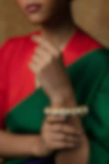 Gold Plated Moissanite Stone & Pearl Kada In Sterling Silver by Varq Jewels at Pernia's Pop Up Shop