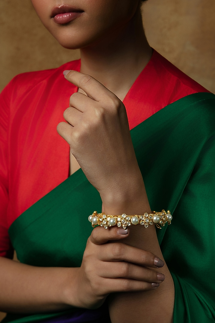 Gold Plated Moissanite Stone & Pearl Kada In Sterling Silver by Varq Jewels at Pernia's Pop Up Shop