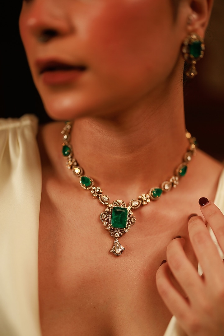 Gold Plated Moissanite Polki & Emerald Necklace Set In Sterling Silver by Varq Jewels at Pernia's Pop Up Shop