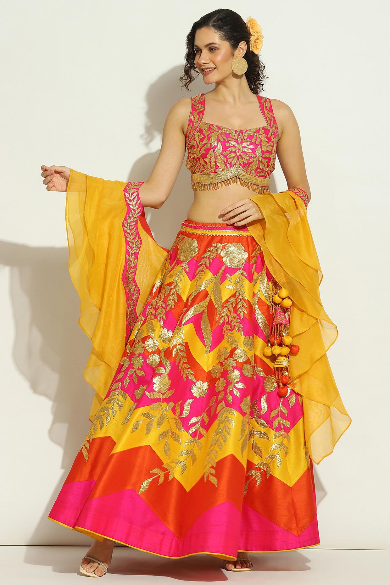 Patch-work lehenga with sequin and bead floral and geometric work paired  with a heavy embroidered blouse and an organza dupatta with embroidered  borders. - ruceru