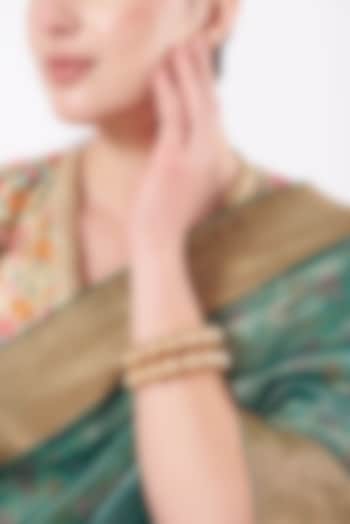 Gold Finish Pearl Bangles (Set of 2) by VASTRAA Jewellery at Pernia's Pop Up Shop