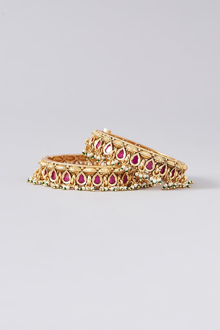 Gold Finish Kundan Polki & Pink Stone Bangles (Set of 2) by VASTRAA Jewellery at Pernia's Pop Up Shop