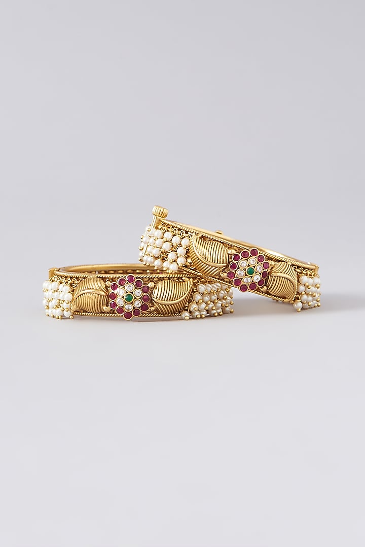 Gold Finish Kundan Polki & Multi-Colored Stone Bangles (Set of 2) by VASTRAA Jewellery at Pernia's Pop Up Shop