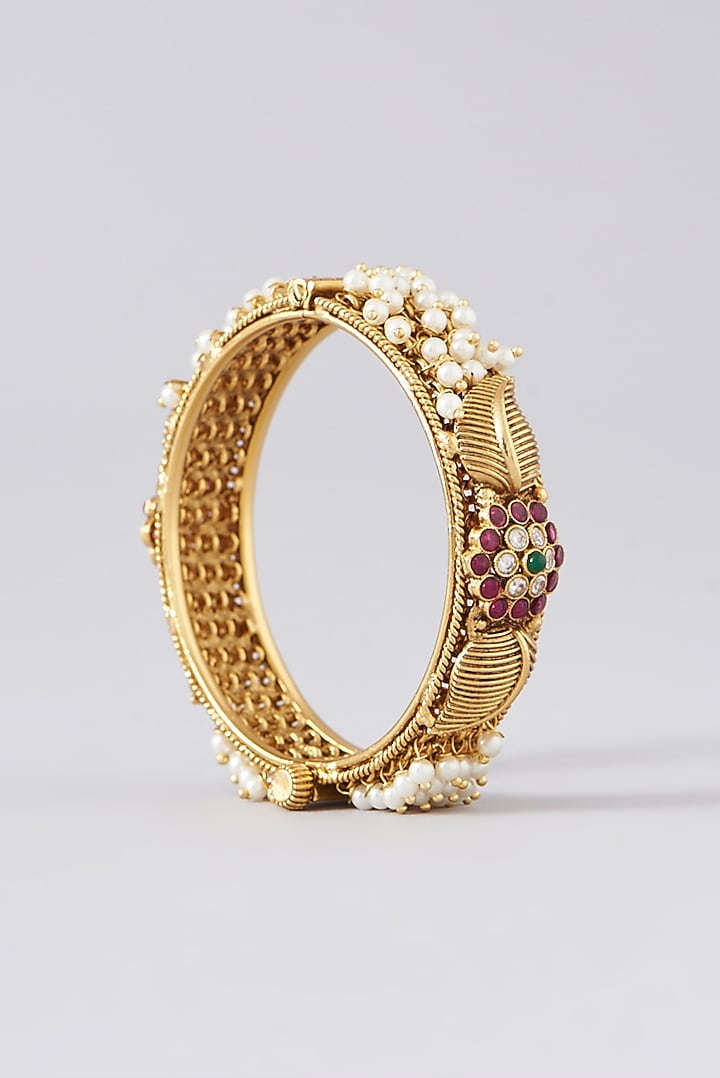 Gold Finish Kundan Polki & Multi-Colored Stone Bangles (Set of 2) by VASTRAA Jewellery at Pernia's Pop Up Shop