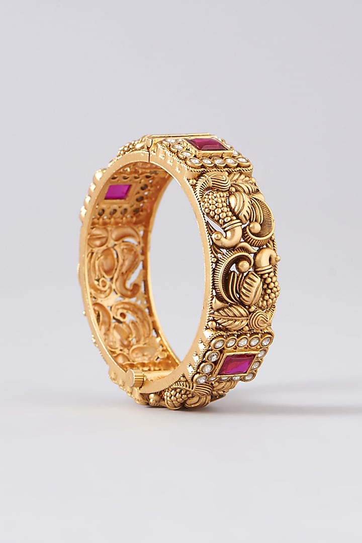 Gold Finish Kundan Polki & Red Stone Bangles (Set Of 2) by VASTRAA Jewellery at Pernia's Pop Up Shop
