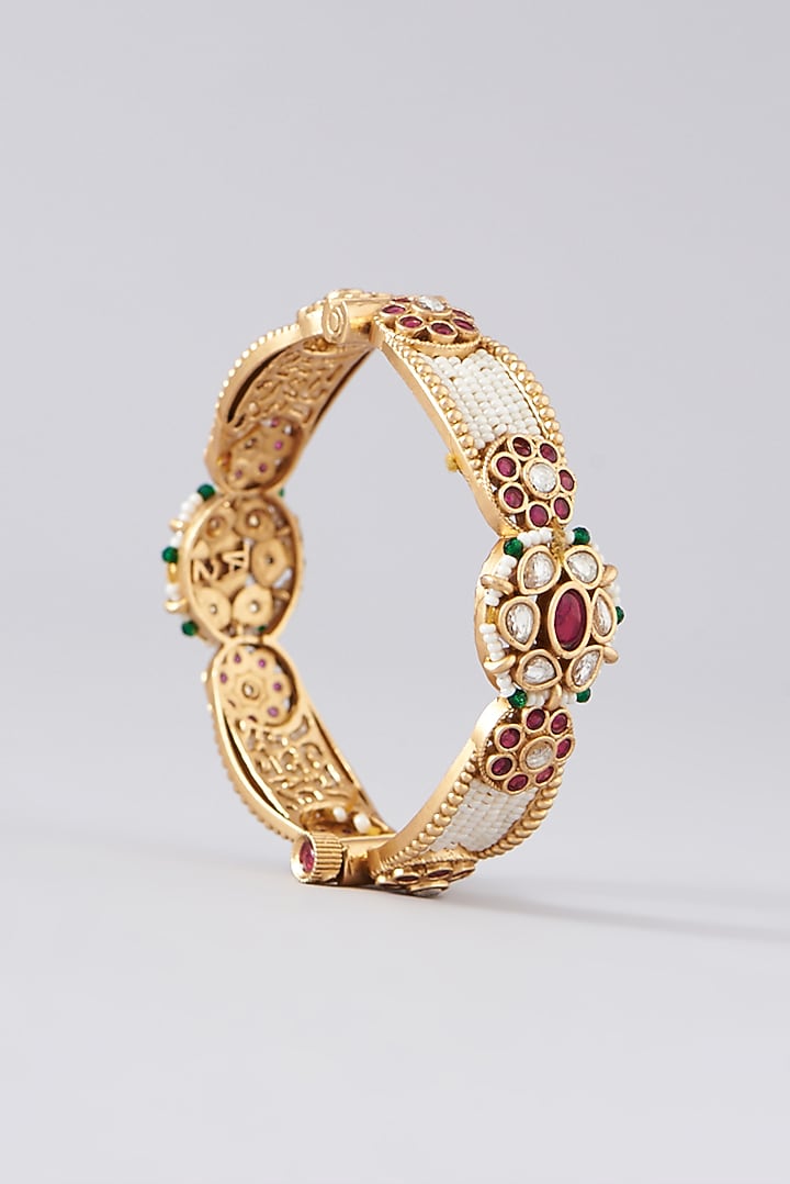 Gold Finish Kundan Polki & Red Stone Bangles (Set of 2) by VASTRAA Jewellery at Pernia's Pop Up Shop