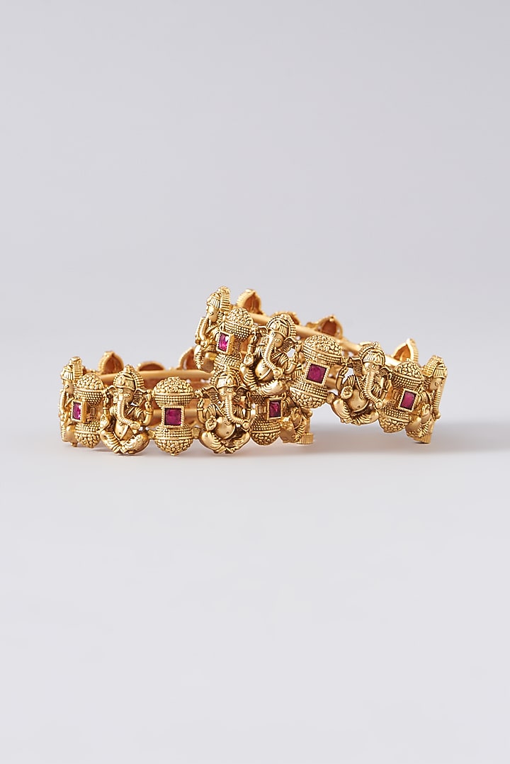 Gold Finish Red Stone Temple Bangles (Set of 2) by VASTRAA Jewellery at Pernia's Pop Up Shop