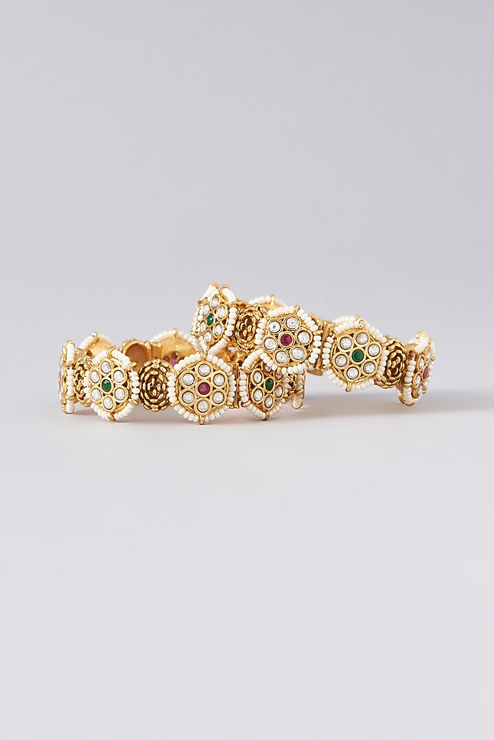Gold Finish Kundan Polki & Red Stone Bangles (Set of 2) by VASTRAA Jewellery at Pernia's Pop Up Shop