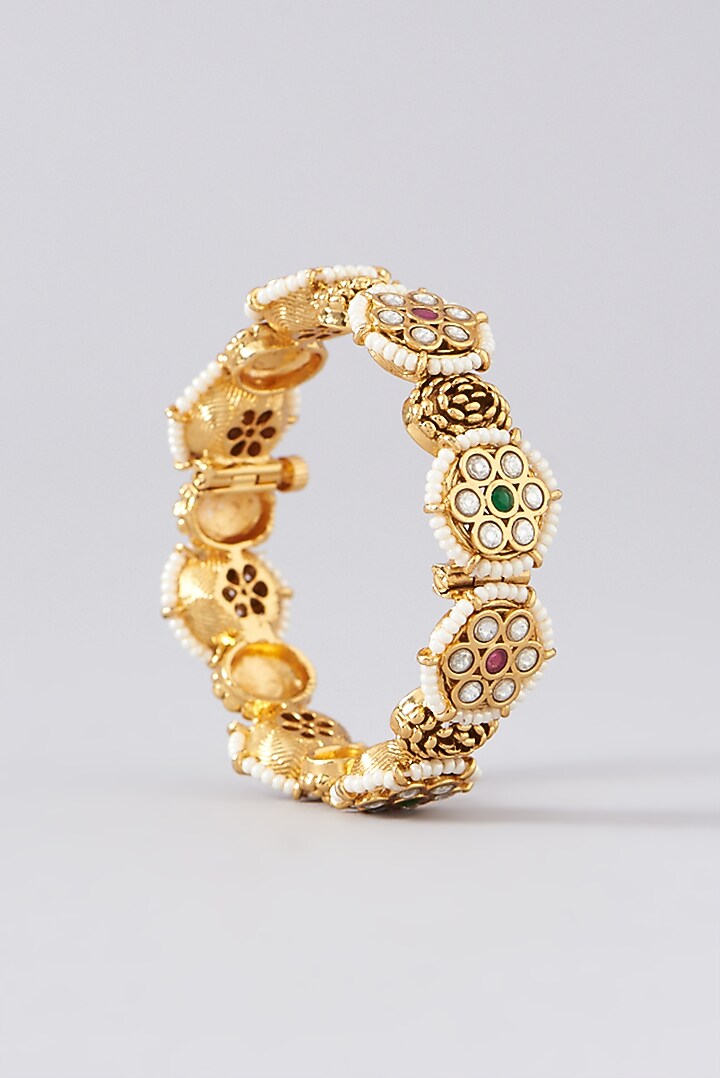 Gold Finish Kundan Polki & Red Stone Bangles (Set of 2) by VASTRAA Jewellery at Pernia's Pop Up Shop