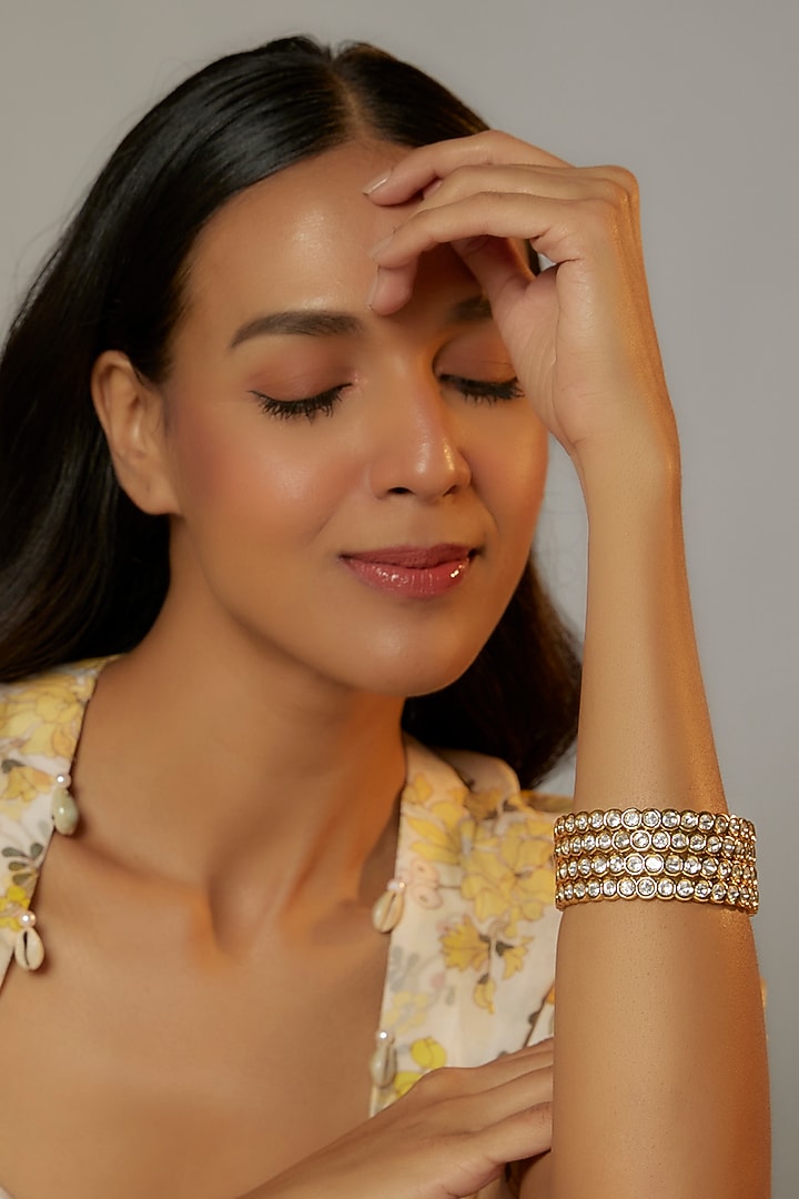 Gold Finish Kundan Polki Bangles (Set of 4) by VASTRAA Jewellery at Pernia's Pop Up Shop