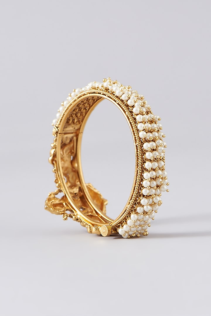Gold Finish Kundan Polki Temple Bangles (Set of 2) by VASTRAA Jewellery at Pernia's Pop Up Shop