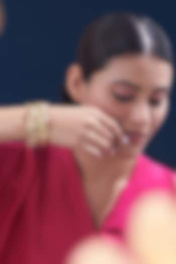 Gold Finish Kundan Polki & Multi-Colored Stone Bangles (Set of 2) by VASTRAA Jewellery at Pernia's Pop Up Shop