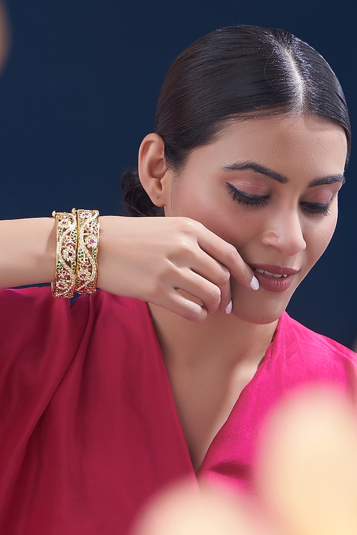 Gold Finish Kundan Polki & Multi-Colored Stone Bangles (Set of 2) by VASTRAA Jewellery at Pernia's Pop Up Shop