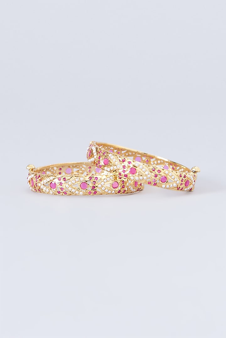 Gold Finish Kundan Polki & Red Stone Bangles (Set of 2) by VASTRAA Jewellery at Pernia's Pop Up Shop