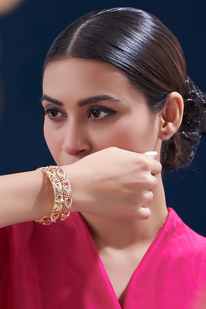 Gold Finish Kundan Polki & Red Stone Bangles (Set of 2) by VASTRAA Jewellery at Pernia's Pop Up Shop