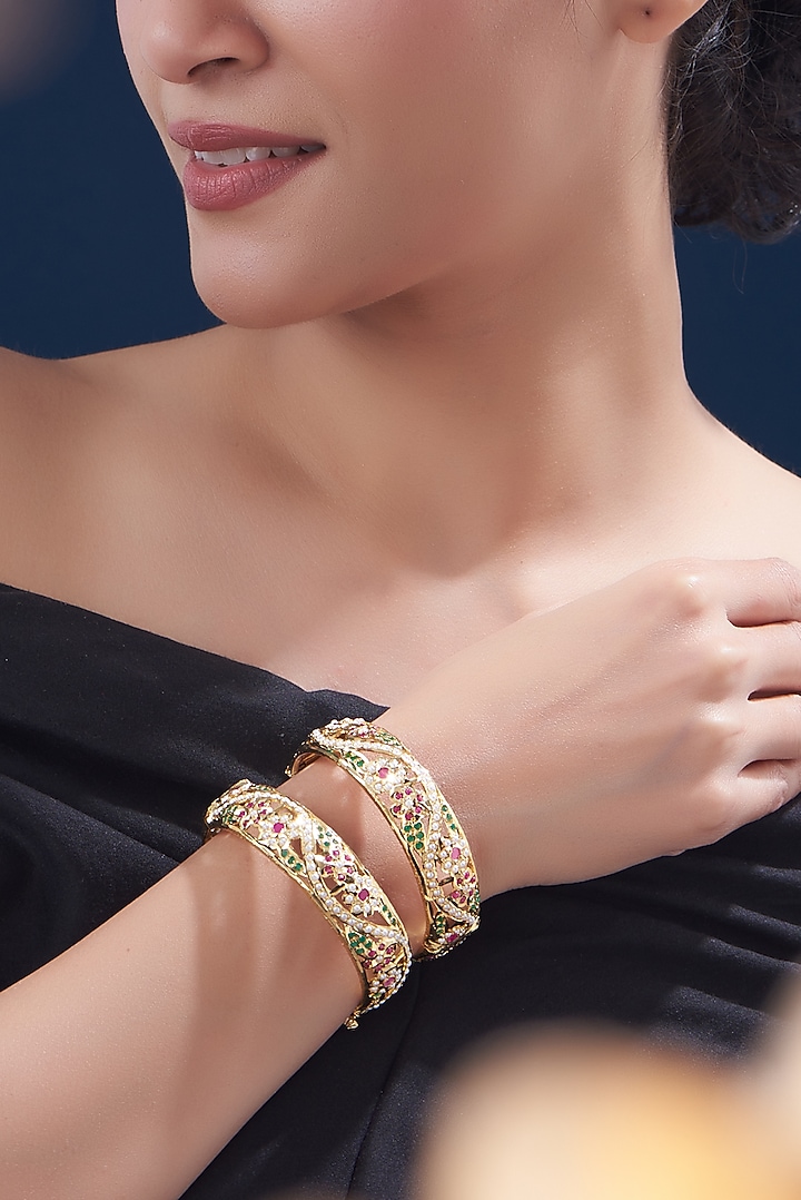 Gold Finish Kundan Polki & Multi-Colored Stone Bangles (Set of 2) by VASTRAA Jewellery at Pernia's Pop Up Shop