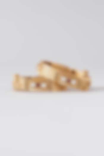 Gold Finish Kundan Polki & Red Stone Bangles (Set Of 2) by VASTRAA Jewellery at Pernia's Pop Up Shop