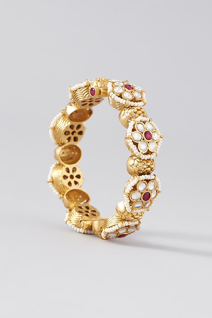 Gold Finish Kundan Polki & Red Stone Bangles (Set Of 2) by VASTRAA Jewellery at Pernia's Pop Up Shop