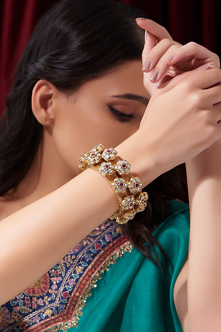 Gold Finish Kundan Polki & Red Stone Bangles (Set Of 2) by VASTRAA Jewellery at Pernia's Pop Up Shop