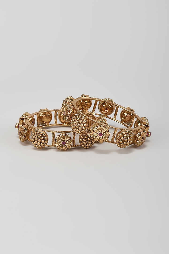 Gold Finish Red Stone Temple Motif Bangles (Set Of 2) by VASTRAA Jewellery at Pernia's Pop Up Shop