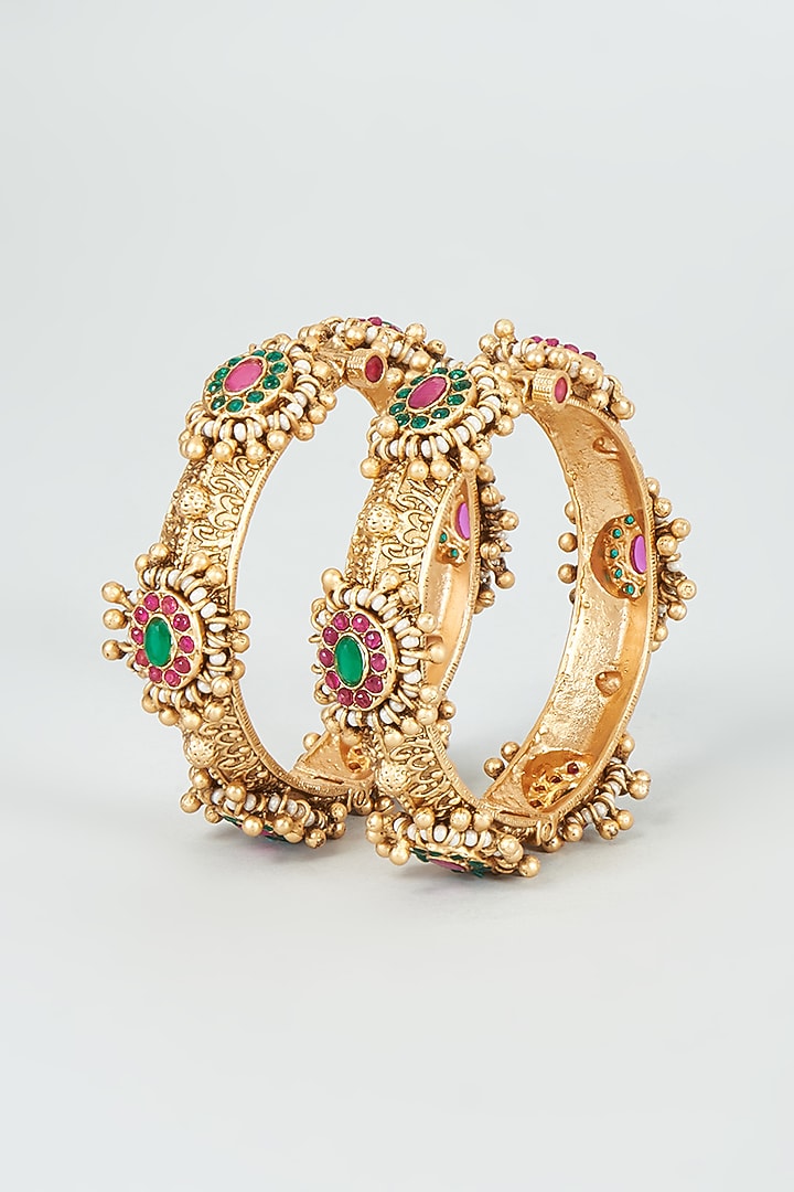 Gold Finish Kundan Polki & Multi-Colored Stone Temple Bangles (Set Of 2) by VASTRAA Jewellery at Pernia's Pop Up Shop